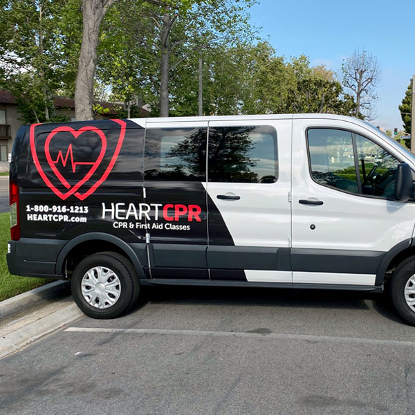Black and white CPR van with graphics 